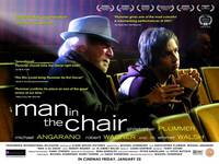 Постер Человек в кресле