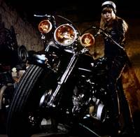 Кадр Девушка на мотоцикле