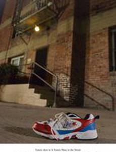 A Tennis Shoe in the Street